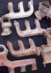 SL6 Exhaust Manifolds Over the Years, Note O2 Sensor Port